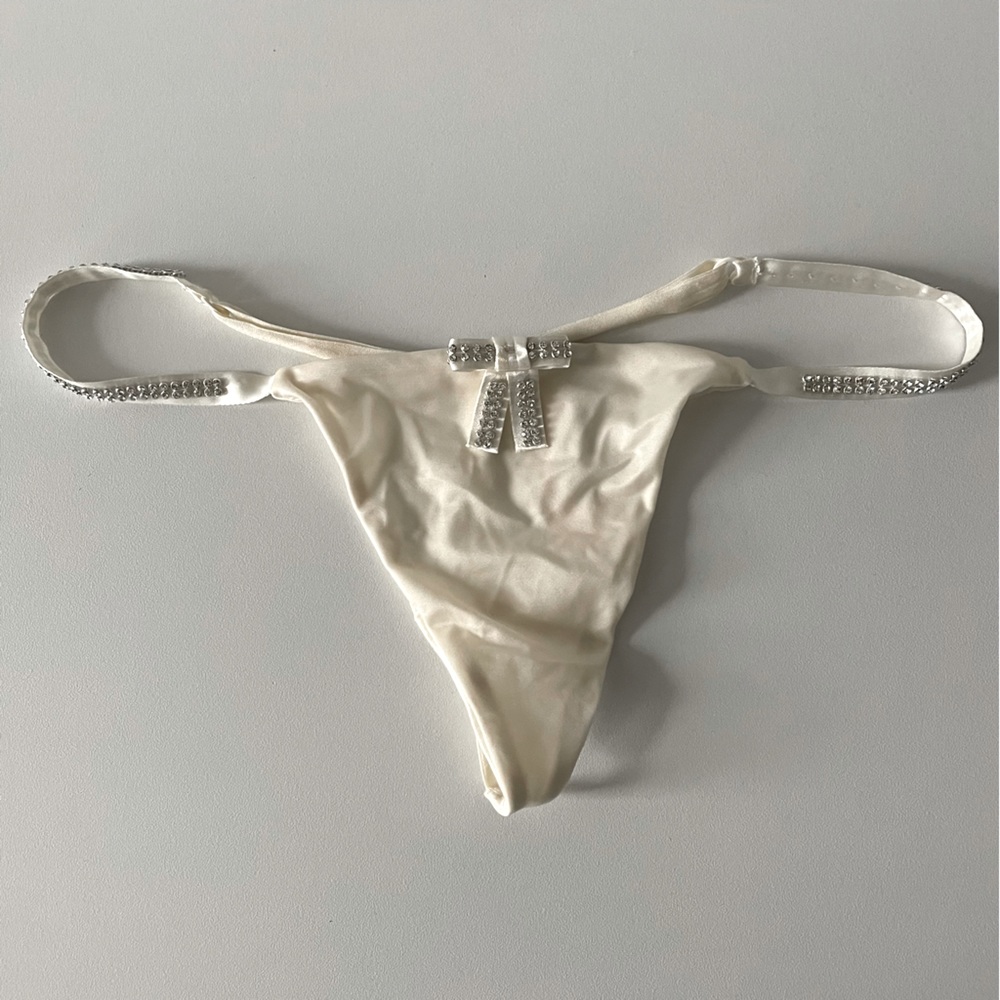 Victoria’s Secret Ivory Thong with crystal details in Size S -NWT.